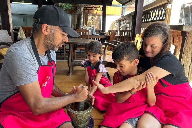 Authentic Thai Cooking Class and Farm Visit in Chiang Mai - Cooking in the open-air kitchen