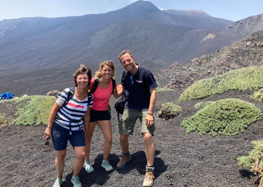 Catania: Guided Tour of Etna with Farm Visit & Food Tasting - Entering a lava-flow cave with a helmet and torch