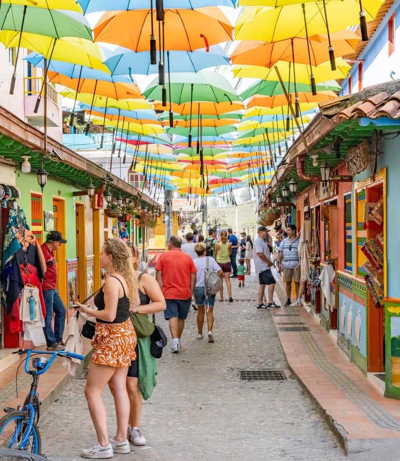 Guatapé Tour by Chiva + Visit to Pablo Escobar's Hacienda - Guatapé’s painted streets and umbrella photos
