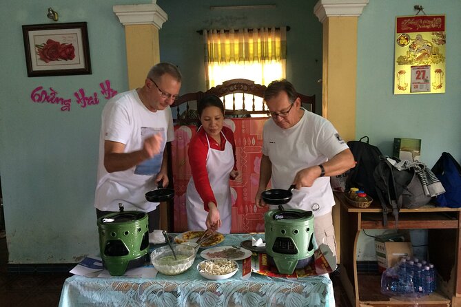 Hoi An Home Hosted Meal in Rice Farmer Home - Turning paddy rice into flour by hand