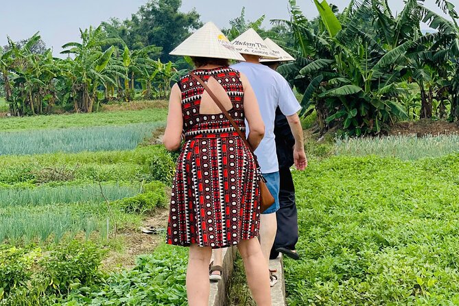 Hue Organic Farm Visit and Traditional Cooking Class - Working at Madam Thu Farm