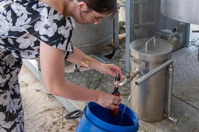 Lavender Harvesting and Distillation Workshop in Bellegarde - Filling bottles with oil and floral water