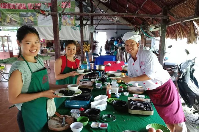 Market to Farm to Table Cooking Class in saigon - Picking produce in an organic farm setting