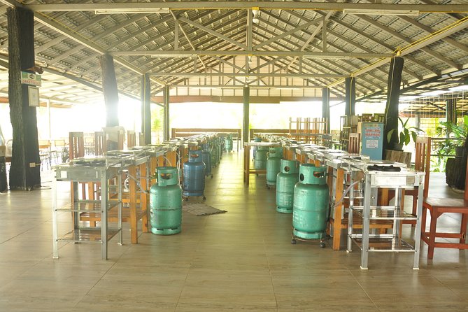 Morning Cooking Class in Organic Farm with Local Market Tour - Learning Thai cooking at your own station