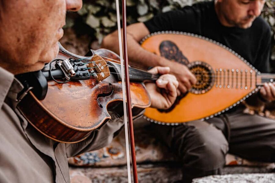 Naxos: Family Farm-table Cooking, Kouros Tour & Live Music - Cooking Greek food over wood and flame