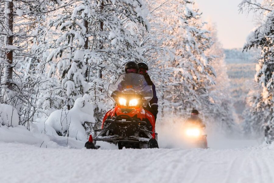 Rovaniemi: Santa’s Village & Snowmobiling to Reindeer Farm - Riding a snowmobile through the Finnish winter