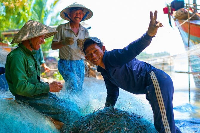 Small Group Bicycle Tour with Farming and Fishing Experience - Coconut palms, bamboo, and a fisherman’s home
