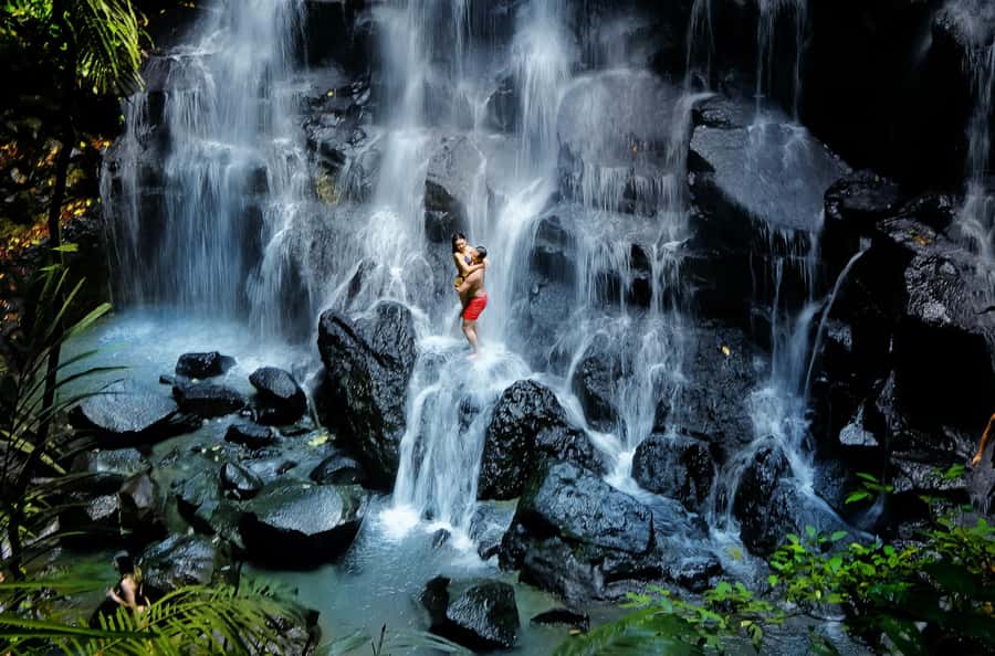 Ubud: Waterfalls & Temple with Rice Terrace Small-Group Tour - Tukad Cepung: rocky paths and a hidden-feeling waterfall