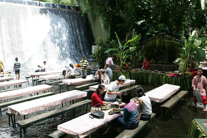 Villa Escudero Coconut Plantation Day Trip from Manila - Riding behind a Philippine carabao